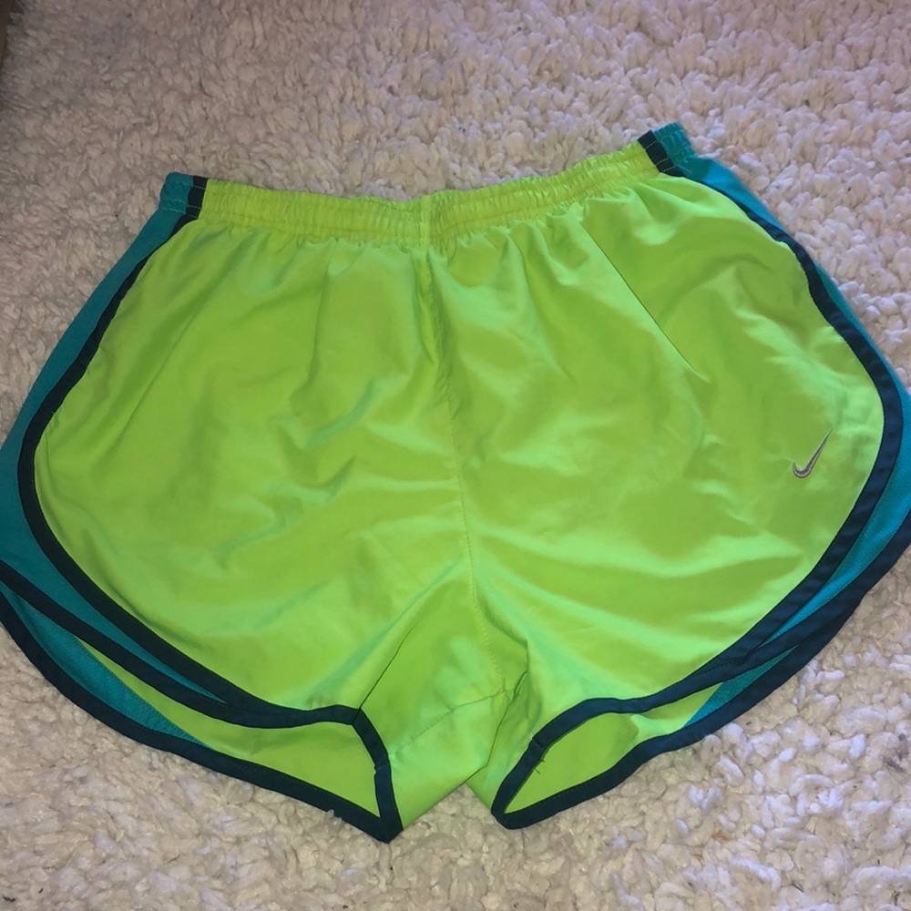 Blue and neon yellow Nike running shorts